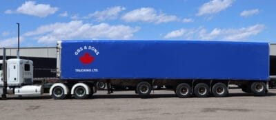 blue rolling tarp closed flatbed trailer